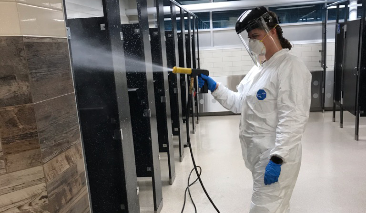 Woman cleaning restroom